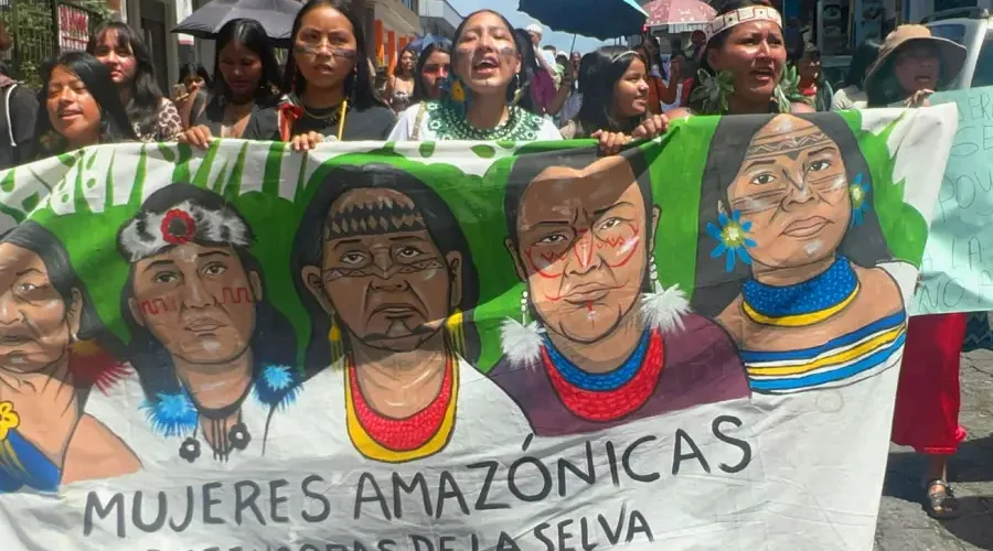 Female environmental defenders march on Aug. 21 in Puyo, Ecuador, calling on governments to respect their rights and the rights of nature. Credit: Katie Surma/Inside Climate News.