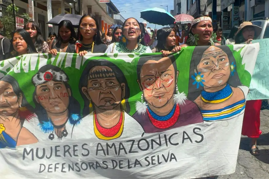 Female environmental defenders march on Aug. 21 in Puyo, Ecuador, calling on governments to respect their rights and the rights of nature. Credit: Katie Surma/Inside Climate News.